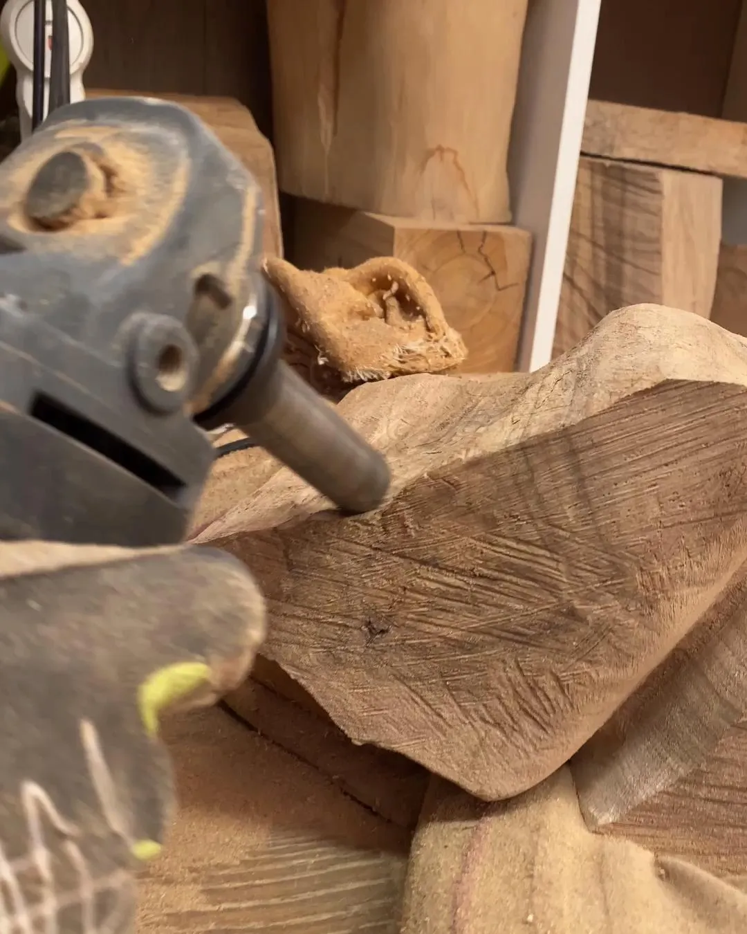 Working on the walnut sculpture Confluence during the carving process in my workshop.