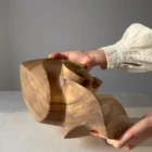 One-of-a-kind abstract walnut sculpture designed as a sculptural vessel for a dry branch.