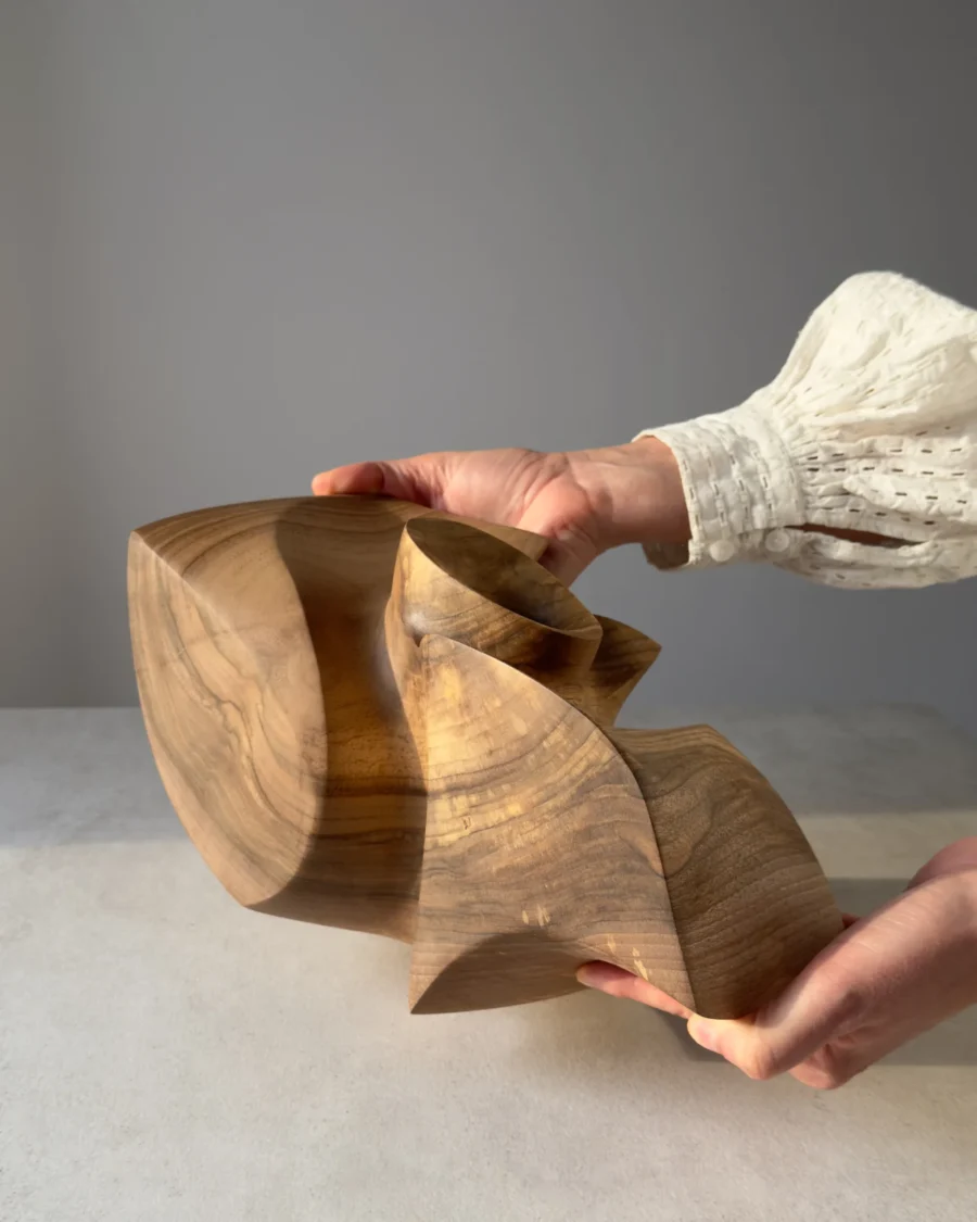 One-of-a-kind abstract walnut sculpture designed as a sculptural vessel for a dry branch.