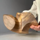Detail of natural walnut grain revealed through hand carving, sanding and matte hardwax oil.