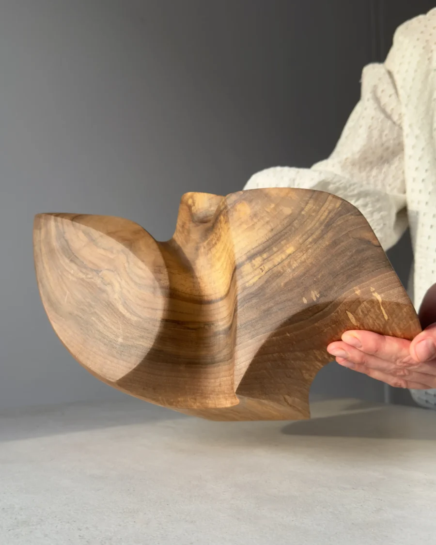 Detail of natural walnut grain revealed through hand carving, sanding and matte hardwax oil.