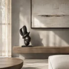 Poise abstract apple wood sculpture in a contemporary minimalist interior, hand-carved from solid wood with a matte black finish.