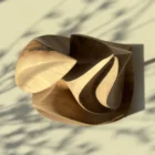 Top view of Silent Ascent abstract walnut sculpture revealing its flowing carved form.