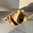 Top view of Together as One hand carved walnut sculpture highlighting organic openings and sculptural form.