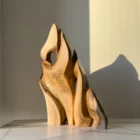 Hand carved walnut wood sculpture Together as One showing flowing biomorphic forms and natural walnut grain.