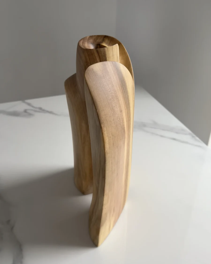 Rear view of Twin Presence hand-carved walnut sculptural vase highlighting the flowing wood grain