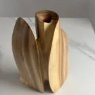 Side view of Twin Presence sculptural wooden vase revealing its organic silhouette and central opening