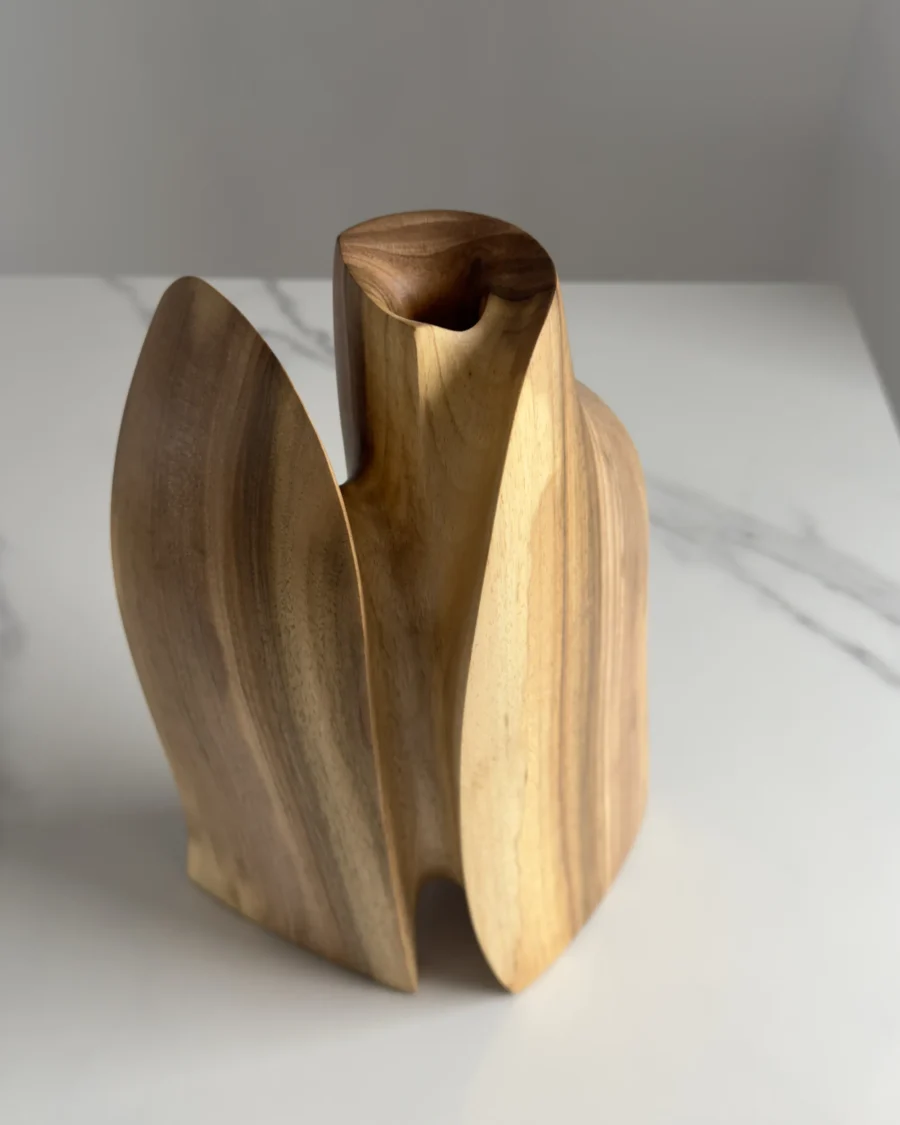 Side view of Twin Presence sculptural wooden vase revealing its organic silhouette and central opening