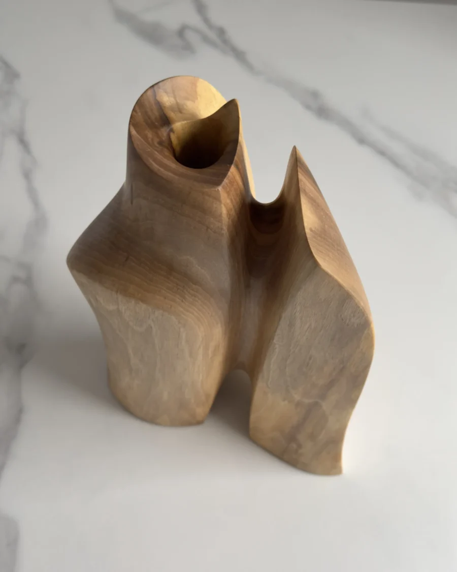 Top view of Twin Presence showing the sculptural opening and removable glass insert for fresh flowers.