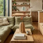 Twin Presence sculptural walnut vase with a natural branch bringing warmth and organic presence to a contemporary living space.