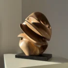 aperture-abstract-walnut-sculpture-front-view-2 Front view of Aperture abstract walnut sculpture revealing its changing layered silhouette