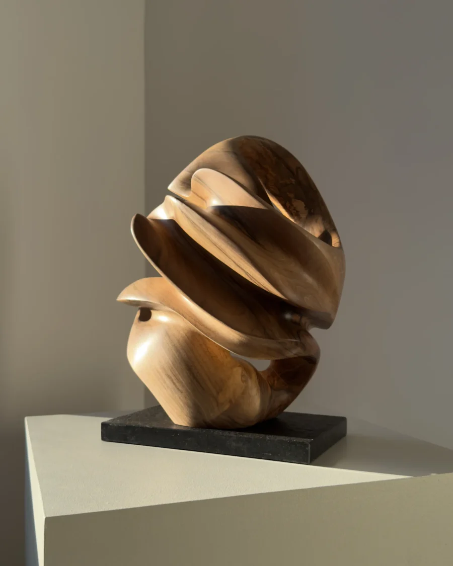 aperture-abstract-walnut-sculpture-front-view-2 Front view of Aperture abstract walnut sculpture revealing its changing layered silhouette