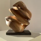 aperture-abstract-walnut-wood-sculpture-front-view-1 Front View Aperture abstract walnut wood sculpture on black granite base in warm natural light