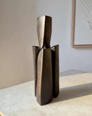 Three-quarter view of Counterpoise organic modern wood vase showing how its three asymmetrical supporting forms change from different angles.
