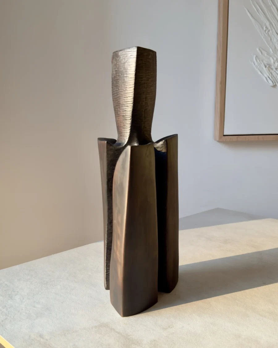 Three-quarter view of Counterpoise organic modern wood vase showing how its three asymmetrical supporting forms change from different angles.