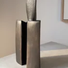 Rear view of Counterpoise sculptural pear wood vase showing the relationship between its central textured axis and two curved outer forms.