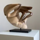becoming-abstract-walnut-wood-sculpture Becoming, one-of-a-kind abstract walnut wood sculpture with an open asymmetrical form, hand-carved from solid wood and displayed on a black granite base.
