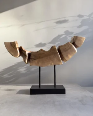 Side perspective of Dynamic Contours showing the flowing carved planes, angular transitions and natural walnut grain.