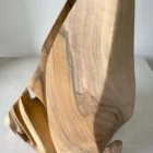 Detail of the hand-carved forms and natural grain transitions in Flowing Unity