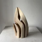 Rear view of Flowing Unity abstract walnut sculpture with pale sapwood and flowing carved forms