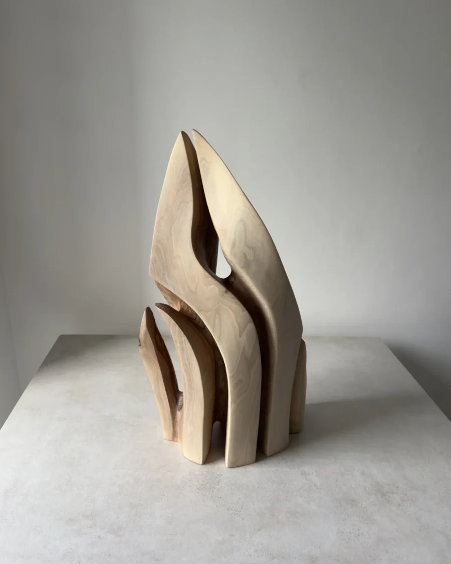 Rear view of Flowing Unity abstract walnut sculpture with pale sapwood and flowing carved forms