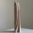 Hush hand-carved apple wood sculptural vase with pale white-waxed finish, shown from the front against a light neutral background.