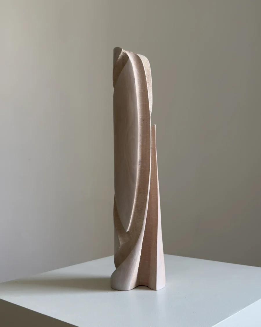 Hush hand-carved apple wood sculptural vase with pale white-waxed finish, shown from the front against a light neutral background.