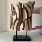 Interstice hand-carved abstract wood sculpture with flowing openings and black granite base, front view