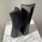 Pendere abstract black wood sculpture in its alternate stable position, showing how the form shifts from vertical balance into movement.