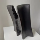 Detail of Pendere showing softly curved black pear wood surfaces beside the deep hand-carved texture created inside the form.