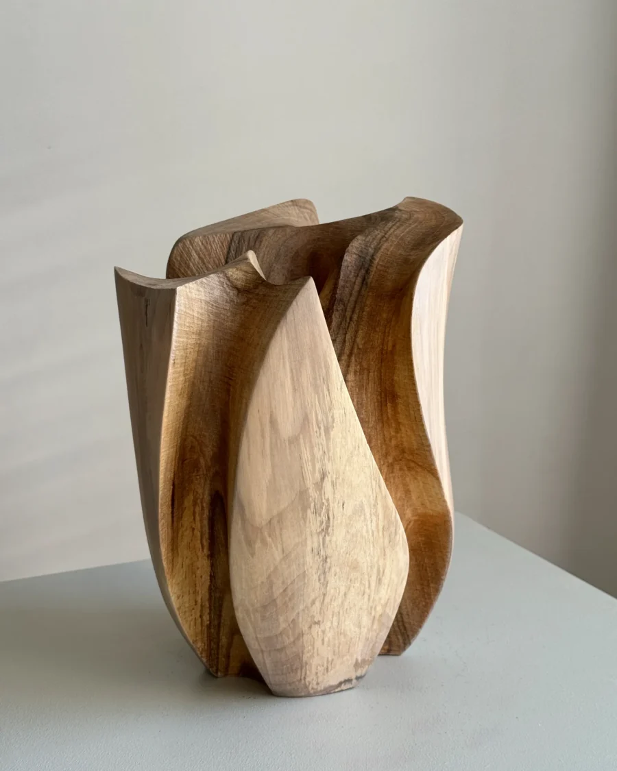 Within seen from the open side, with a pale curved outer section set between flowing darker walnut channels.