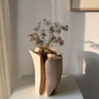 Within from the opposite side with dried stems, showing how sunlight changes the colour and depth of its carved walnut surfaces.