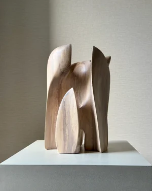 Embrace abstract walnut wood sculpture, hand-carved with flowing organic forms surrounding an open centre