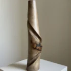 quiet-turn-hand-carved-walnut-vase-front Front view of Quiet Turn, a hand carved walnut wood vase with black resin inclusion and sculptural diagonal movement.