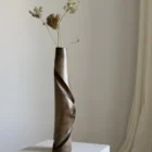 quiet-turn-wabi-sabi-walnut-vase-dried-flowers Quiet Turn hand carved walnut vase styled with dried wildflowers in a calm wabi-sabi inspired interior.
