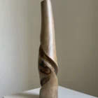 quiet-turn-walnut-sculptural-vase-main-view Quiet Turn one-of-a-kind walnut sculptural vase, showing the black resin detail, flowing carved cuts and softly toned smooth surface.